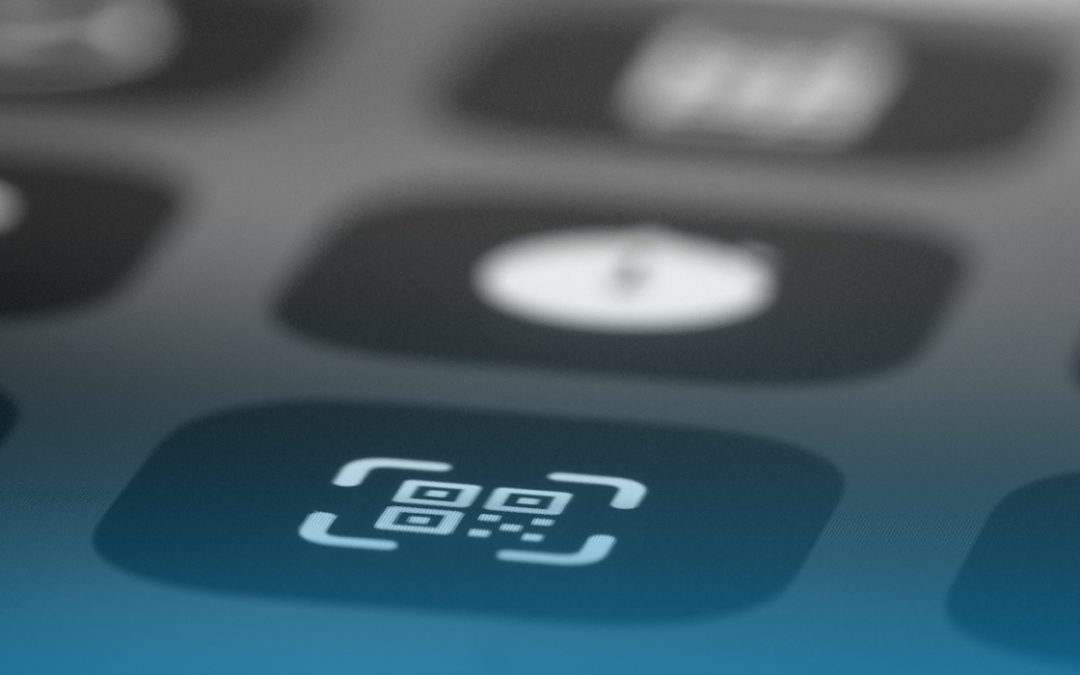 Close up on a phone or tablet screen; main focus on a QR code icon